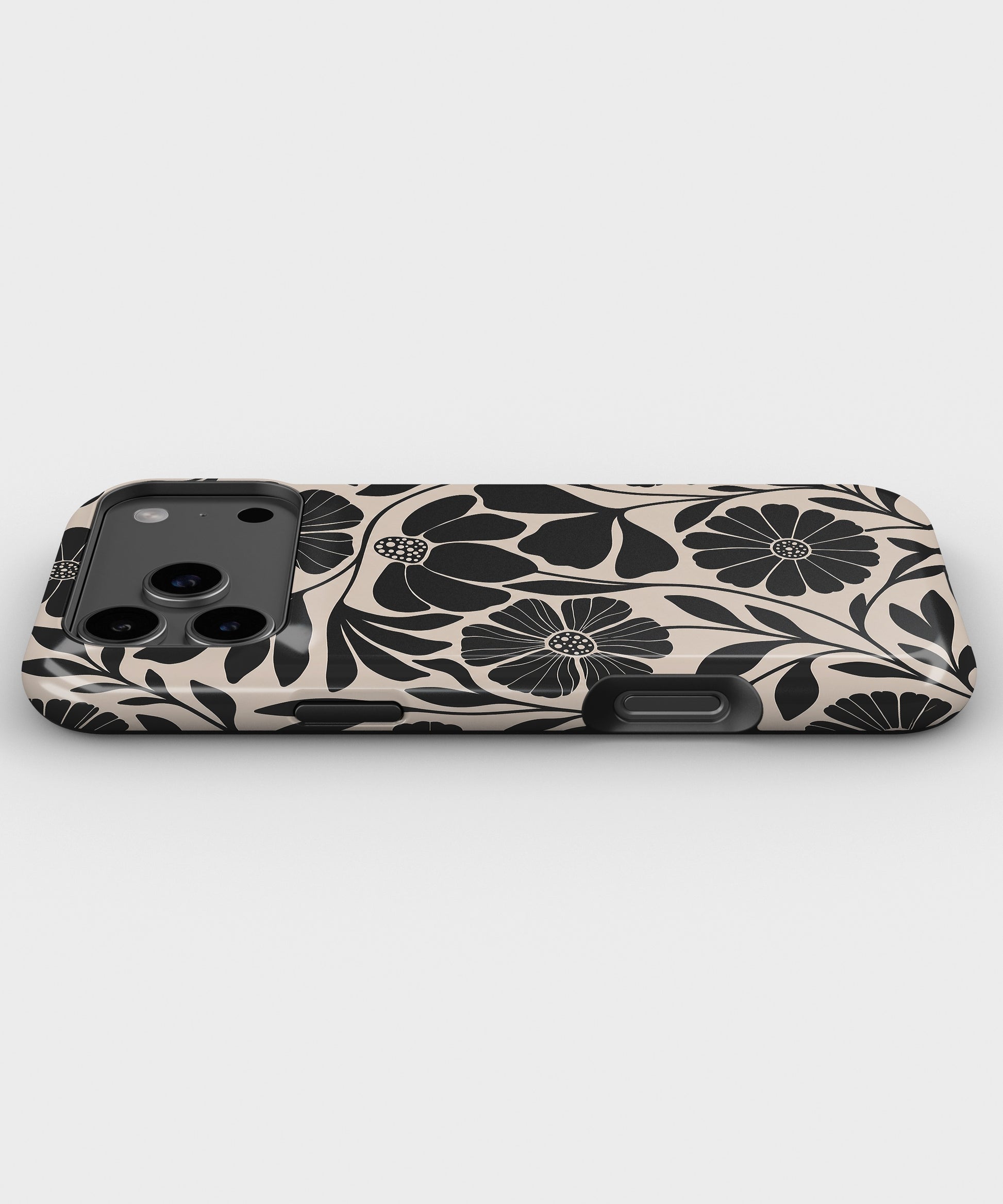 Black Cream Retro Floral MagSafe iPhone Tough Case low angle lifestyle product view