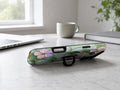 Aqua Grape Stained Glass Floral MagSafe Loop iPhone Case shown in a neutral white professional lifestyle setting