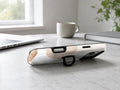 Beige Abstract Pebble MagSafe Loop iPhone Case shown in a neutral white professional lifestyle setting