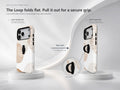 Beige Abstract Pebble MagSafe Loop iPhone Case side view showing the built-in finger loop
