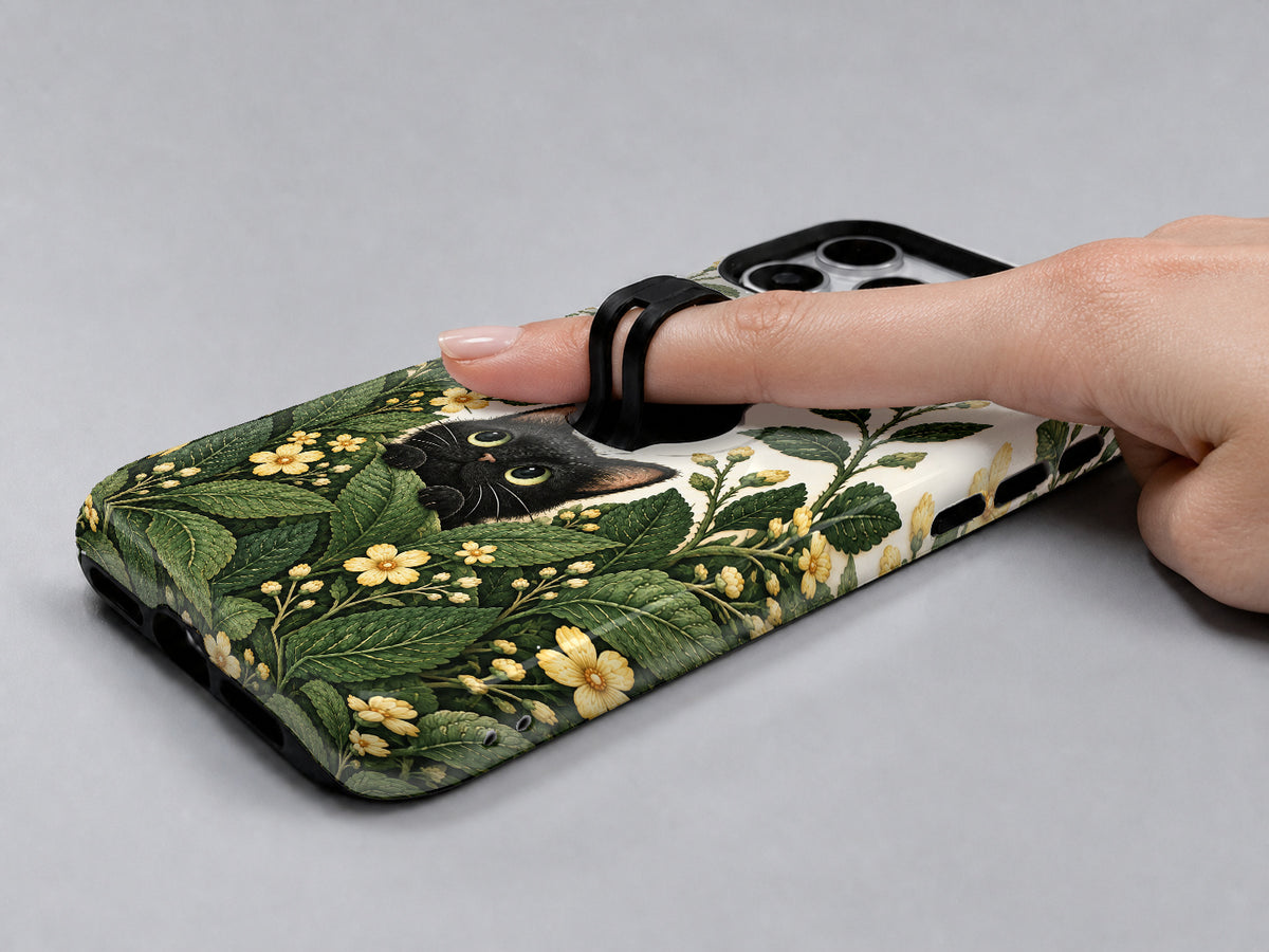 Black Cat Botanical Garden MagSafe Loop iPhone Case, shown in use with a finger through the loop