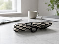 Black Cream Wavy Checkerboard MagSafe Loop iPhone Case shown in a neutral white professional lifestyle setting