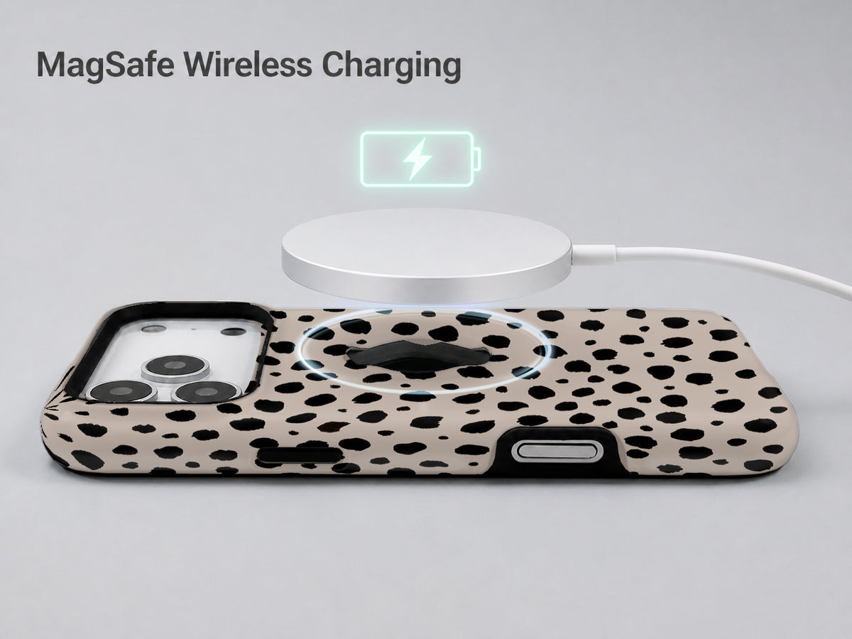 Black Dalmatian Spot MagSafe Loop iPhone Case shown with a MagSafe-compatible wireless charger attached