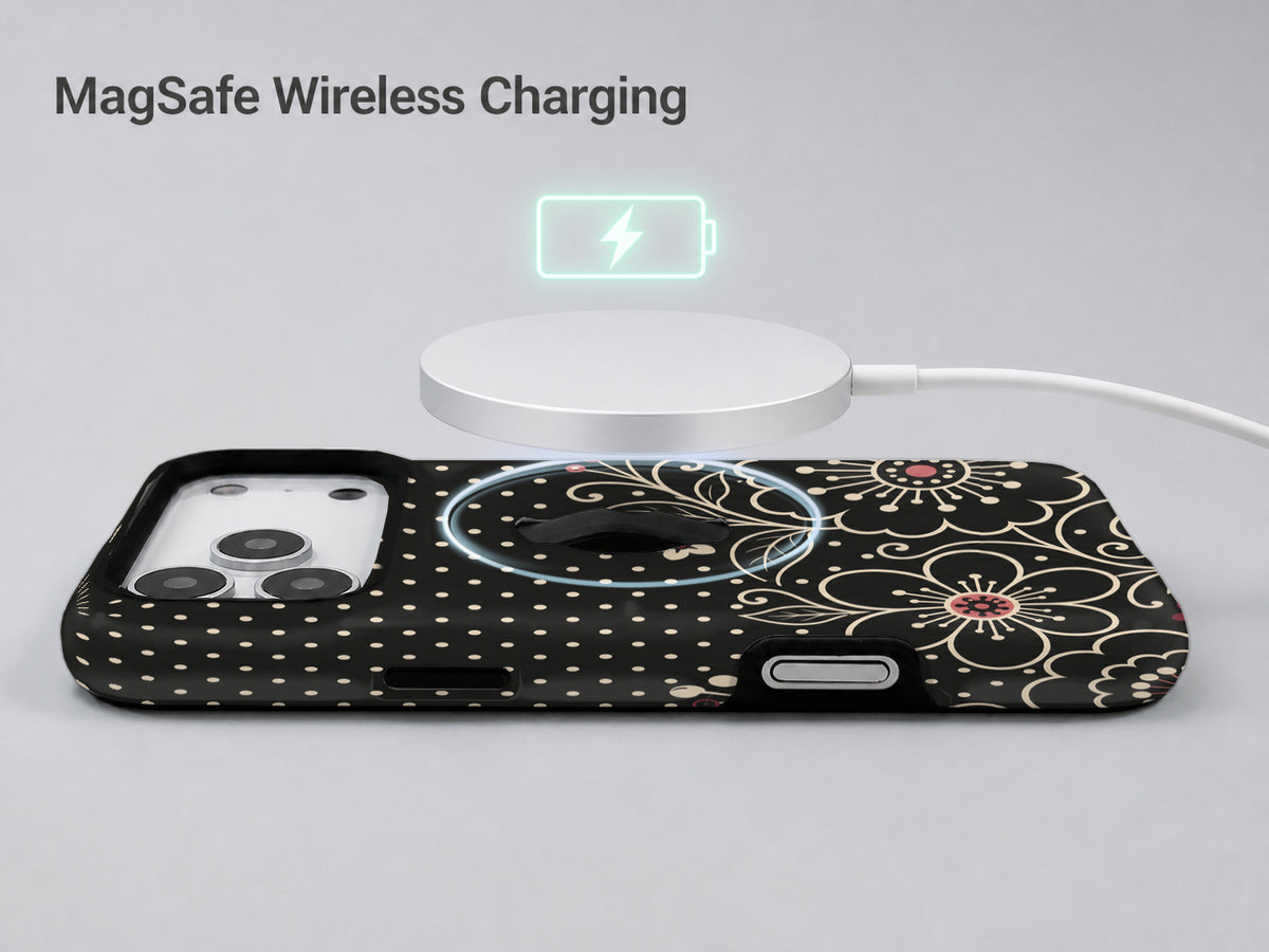 Black Pink Henna Floral MagSafe Loop iPhone Case shown with a MagSafe-compatible wireless charger attached