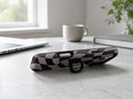 Black Taupe Wavy Checkerboard MagSafe Loop iPhone Case shown in a neutral white professional lifestyle setting