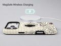 Black White Doodle Floral MagSafe Loop iPhone Case shown with a MagSafe-compatible wireless charger attached
