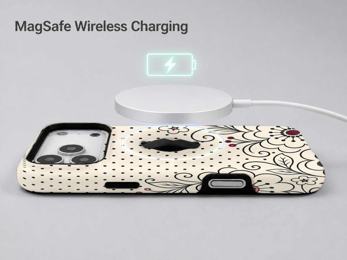 Black White Doodle Floral MagSafe Loop iPhone Case shown with a MagSafe-compatible wireless charger attached