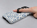 Blue Botanical Floral MagSafe Loop Case, shown with a finger through the loop