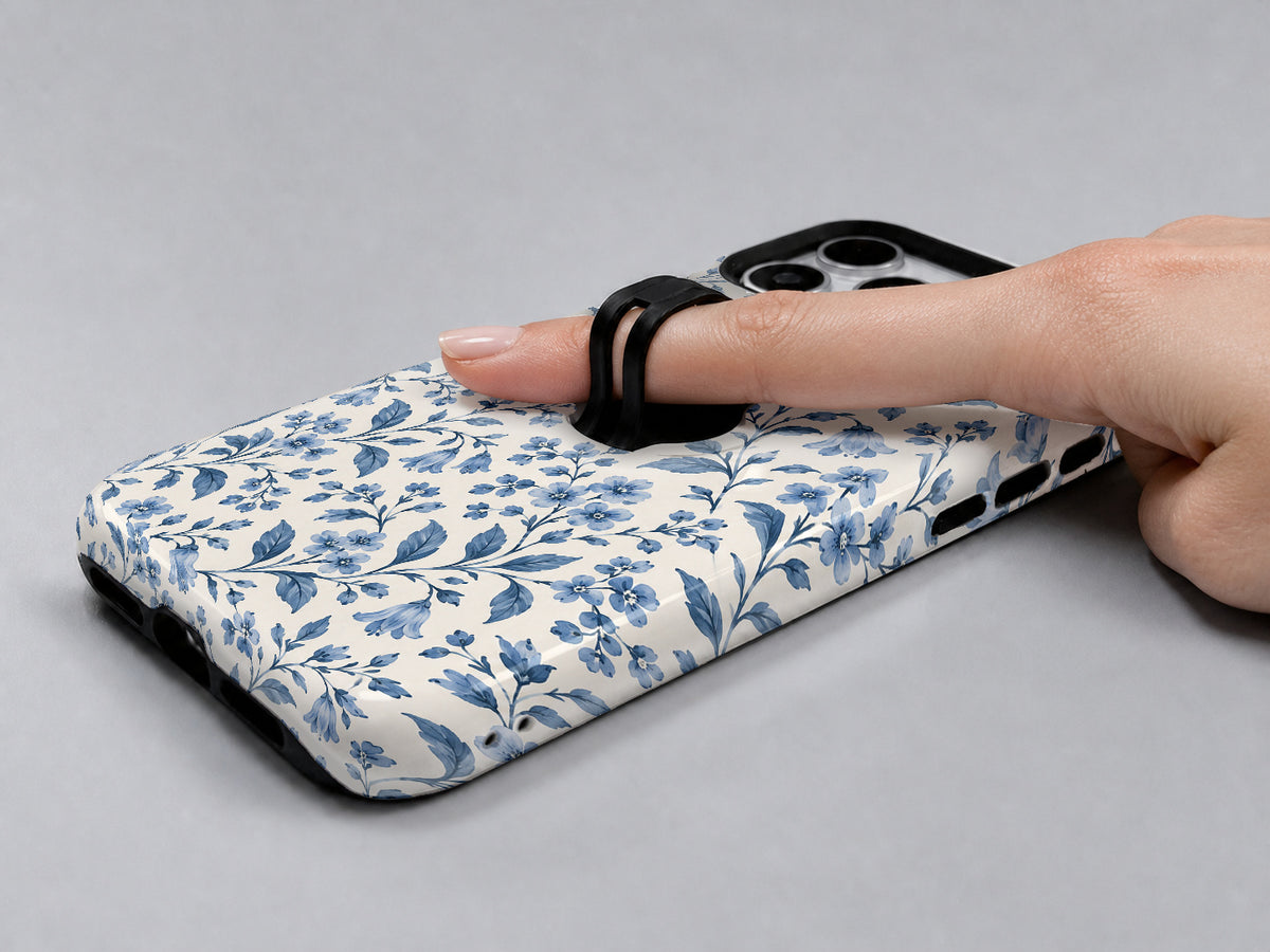 Blue Botanical Floral MagSafe Loop Case, shown with a finger through the loop