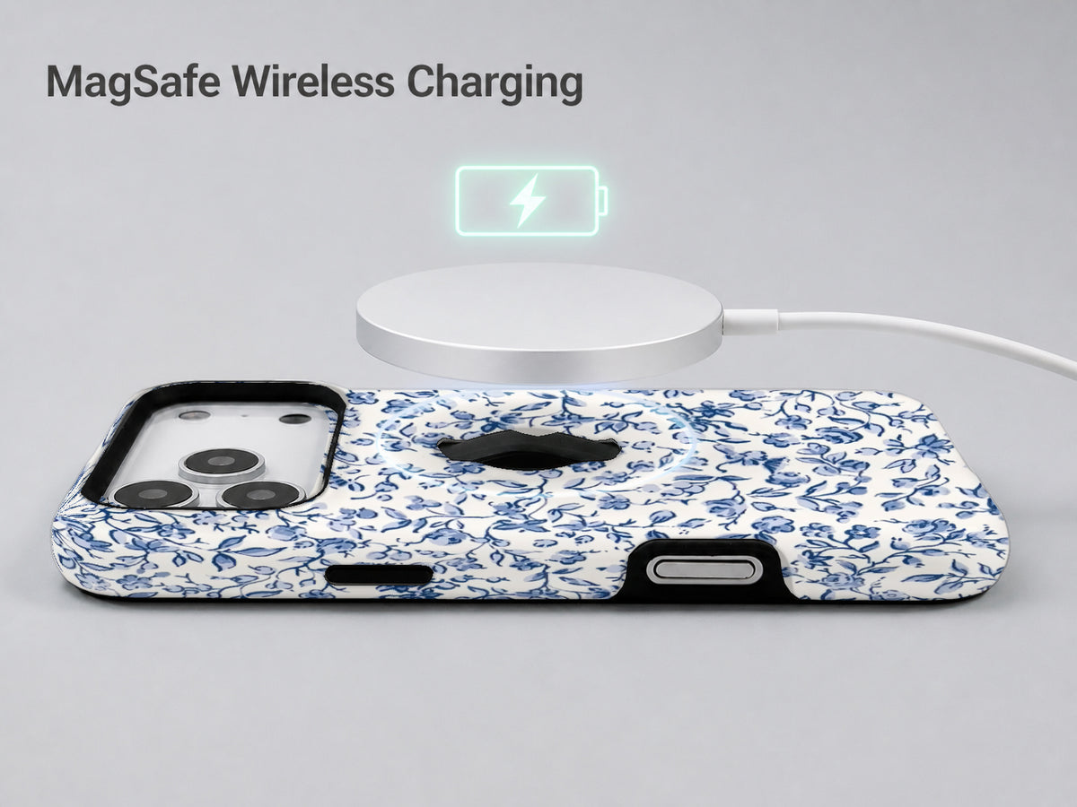Blue Chinoiserie Floral MagSafe Loop iPhone Case shown with a MagSafe-compatible wireless charger attached
