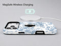 Blue Chinoiserie Rose MagSafe Loop iPhone Case shown with a MagSafe-compatible wireless charger attached