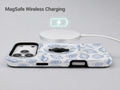 Blue Coastal Seashell MagSafe Loop iPhone Case shown with a MagSafe-compatible wireless charger attached