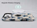 Blue Coquette Bow MagSafe Loop iPhone Case shown with a MagSafe-compatible wireless charger attached