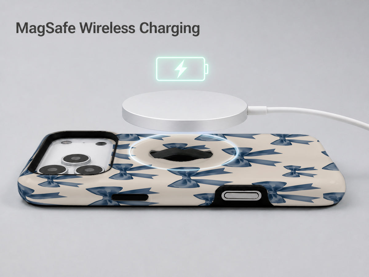 Blue Coquette Bow MagSafe Loop iPhone Case shown with a MagSafe-compatible wireless charger attached