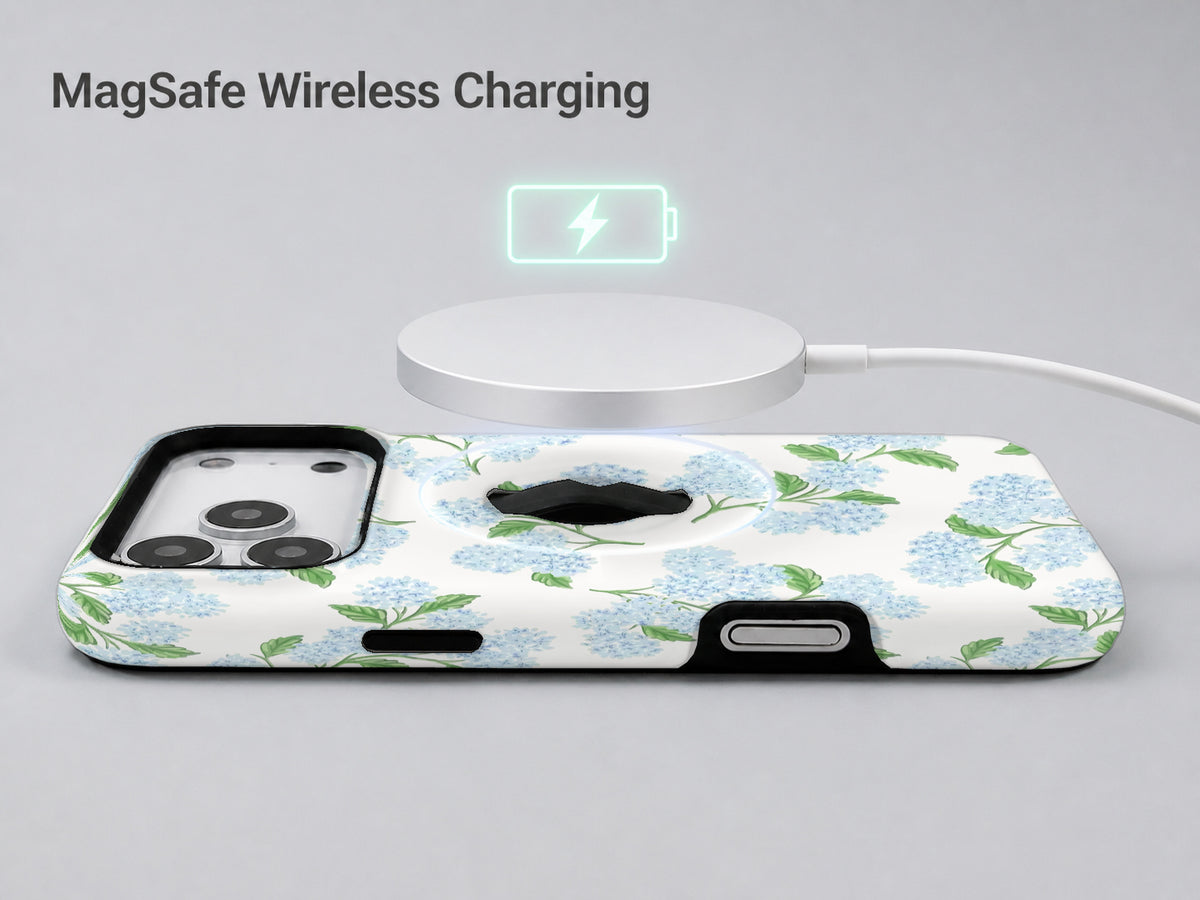 Blue Hydrangea Botanical MagSafe Loop iPhone Case shown with a MagSafe-compatible wireless charger attached