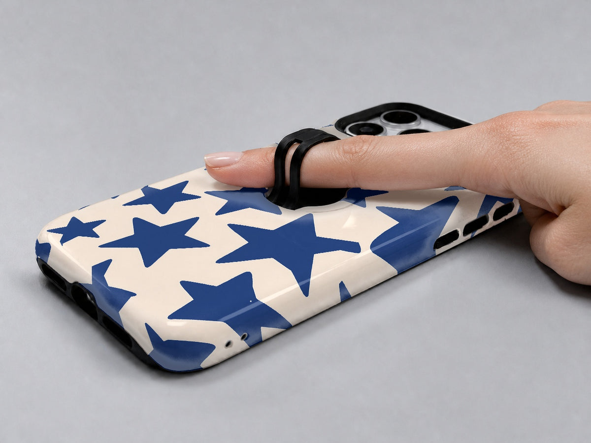 Blue Star Pattern MagSafe Loop iPhone Case shown in use with a finger through the horizontal loop