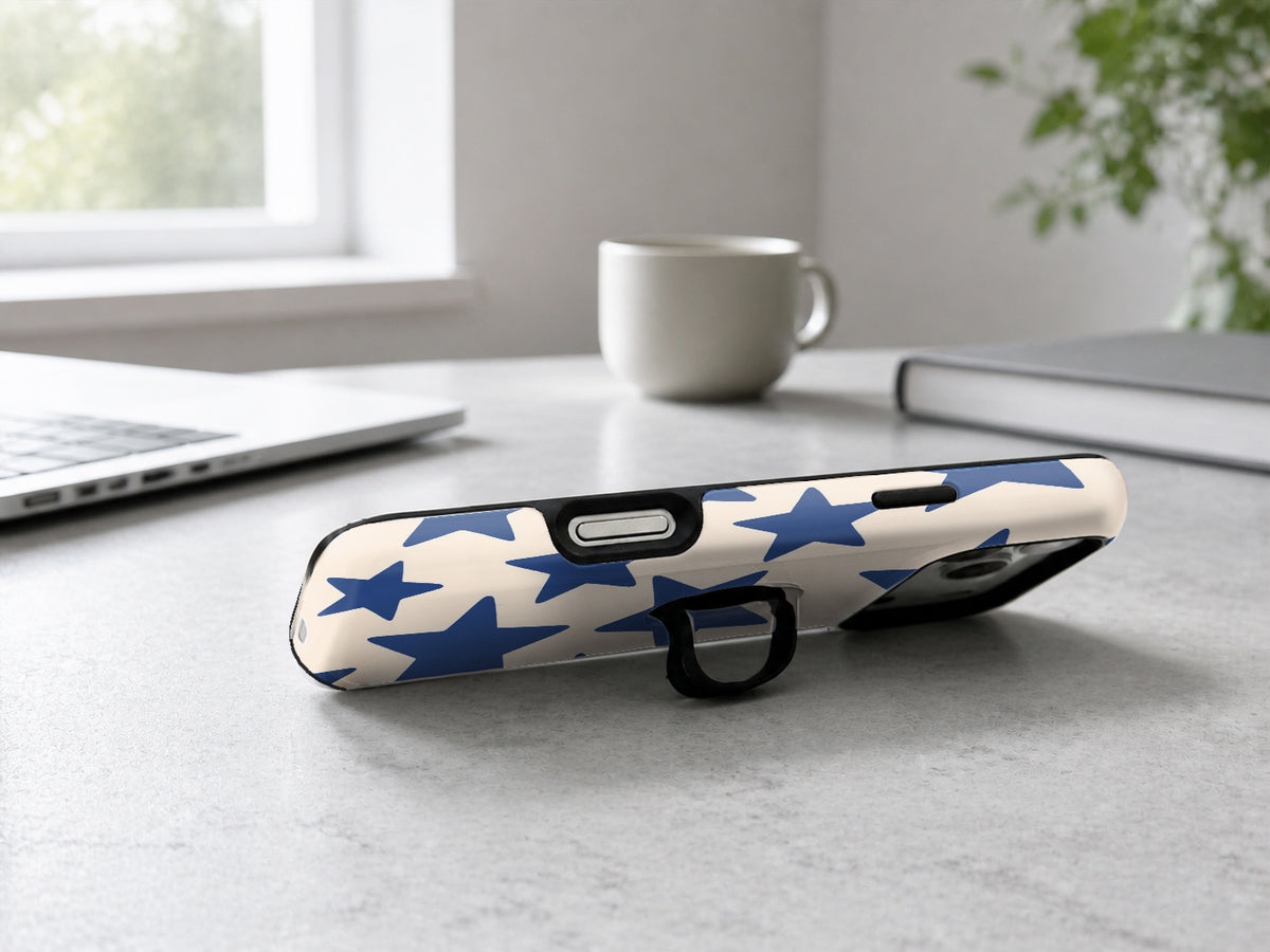 Blue Star Pattern MagSafe Loop iPhone Case shown in a neutral white professional lifestyle setting