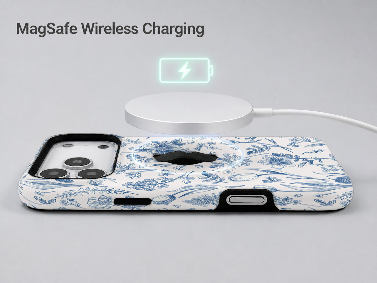 Blue Toile Wildflower MagSafe Loop iPhone Case shown with a MagSafe-compatible wireless charger attached
