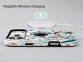 Blue White Daisy Wildflower MagSafe Loop iPhone Case shown with a MagSafe-compatible wireless charger attached