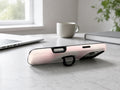 Blush Pink Abstract Gradient MagSafe Loop iPhone Case shown in a neutral white professional lifestyle setting