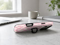 Blush Pink Checkerboard MagSafe Loop iPhone Case shown in a neutral white professional lifestyle setting