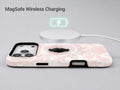 Blush Pink Chinoiserie Floral MagSafe Loop iPhone Case shown with a MagSafe-compatible wireless charger attached
