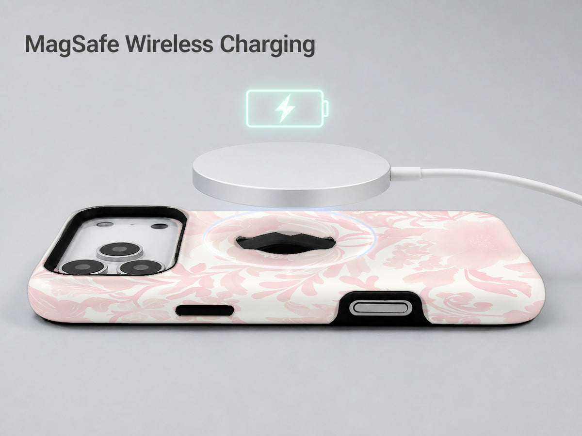 Blush Pink Chinoiserie Floral MagSafe Loop iPhone Case shown with a MagSafe-compatible wireless charger attached