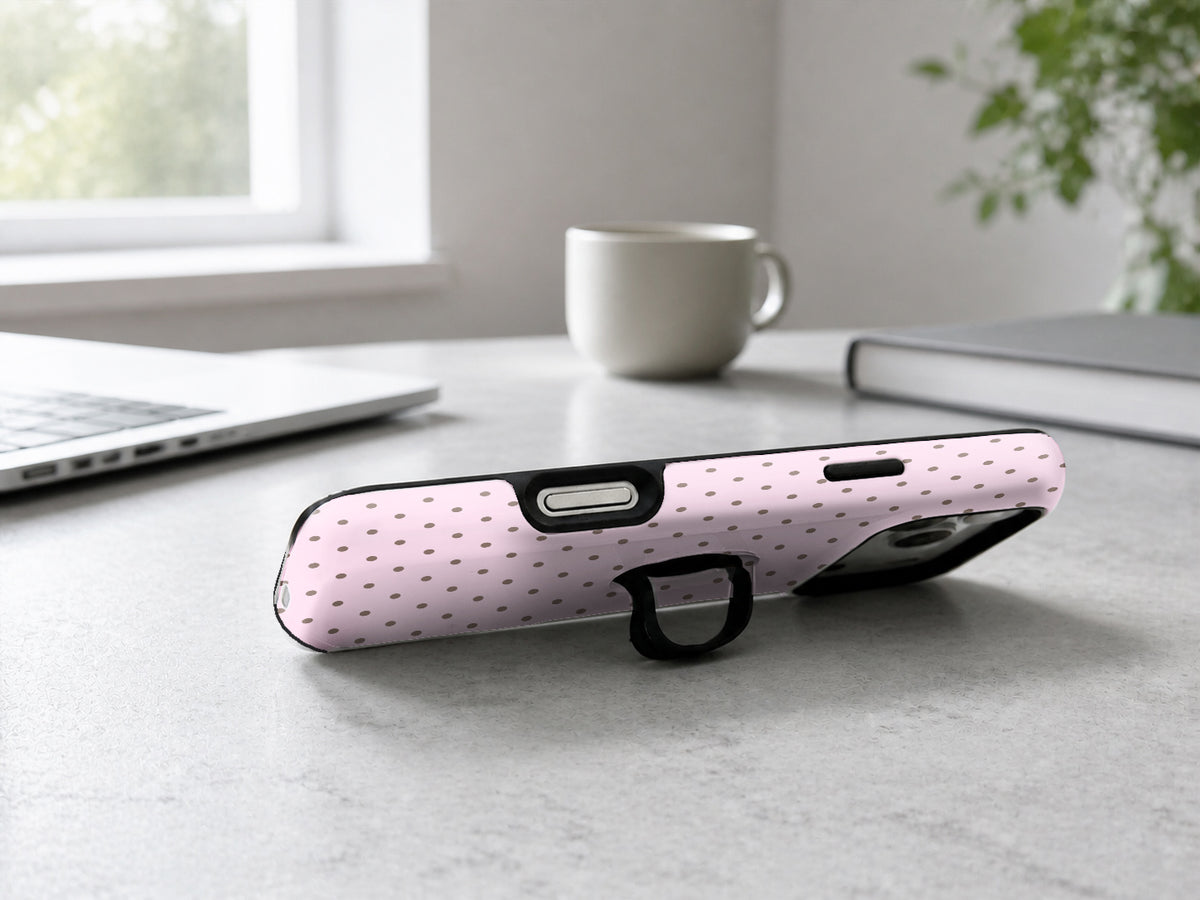 Blush Pink Mini Polka Dot MagSafe Loop iPhone Case shown in a neutral white professional lifestyle setting