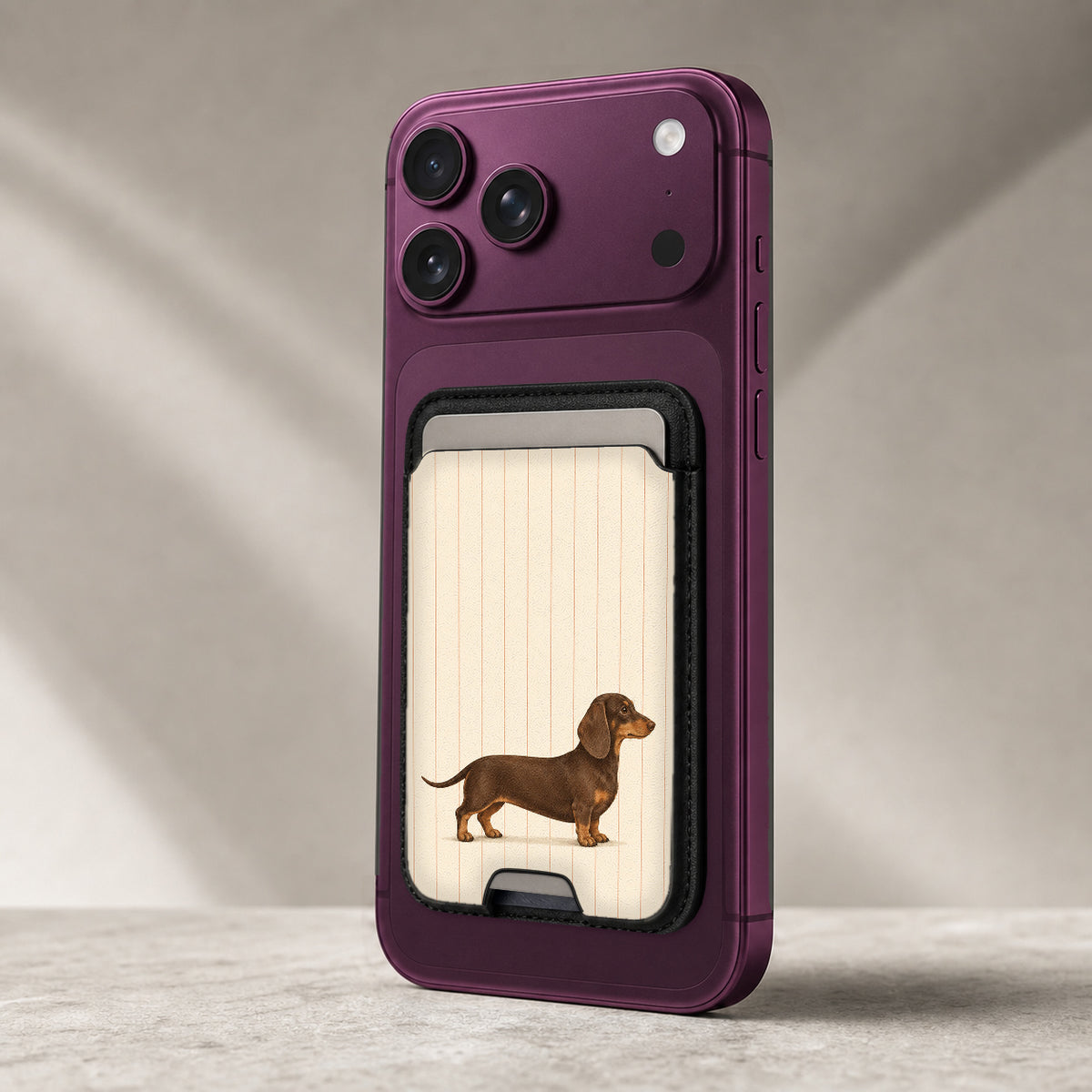 Brown Dachshund on Cream Pinstripes MagSafe Card Holder, attached to a compatible phone