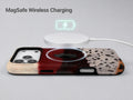 Burgundy Cream Abstract Animal Print MagSafe Loop iPhone Case shown with a MagSafe-compatible wireless charger attached