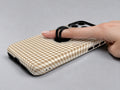 Caramel Brown and White Gingham MagSafe Loop Case, shown with a finger through the loop