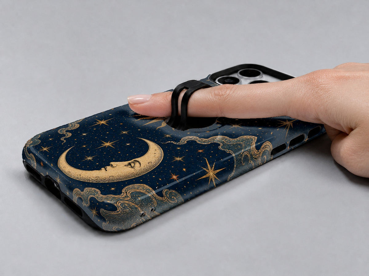 Celestial Sun and Moon MagSafe Loop iPhone Case shown in use with a finger through the horizontal loop