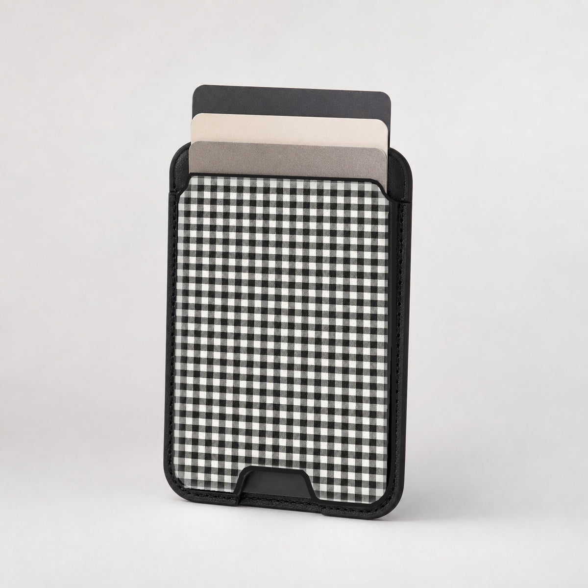 Charcoal Black and White Gingham MagSafe Card Holder, card storage shown with cards