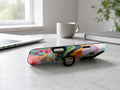 Colorful Abstract Landscape Floral MagSafe Loop iPhone Case shown in a neutral white professional lifestyle setting