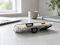Colorful Pressed Wildflower MagSafe Loop iPhone Case shown in a neutral white professional lifestyle setting