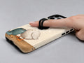 Cookie Time Goose MagSafe Loop Case, shown with a finger through the loop