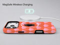 Coral Pink Scallop MagSafe Loop iPhone Case shown with a MagSafe-compatible wireless charger attached