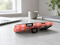 Coral Pink Scallop MagSafe Loop iPhone Case shown in a neutral white professional lifestyle setting
