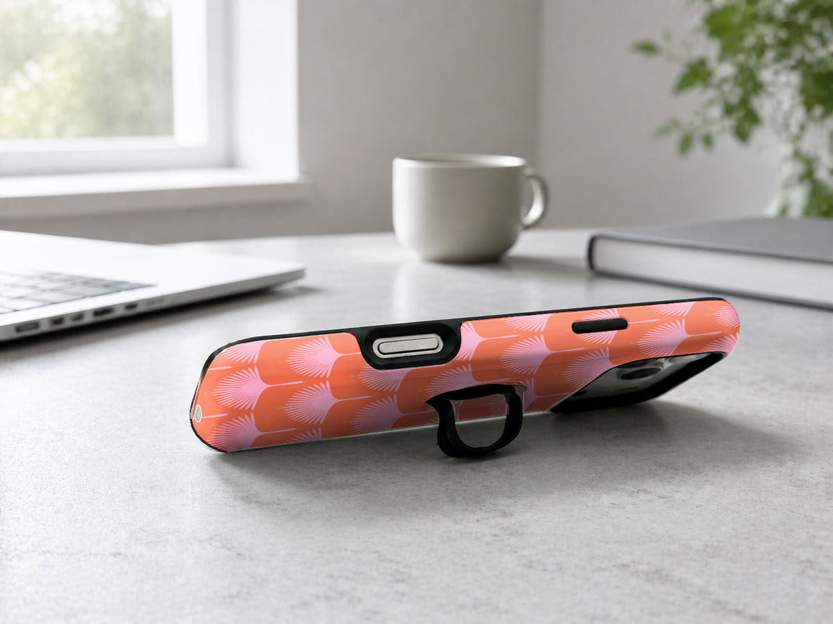 Coral Pink Scallop MagSafe Loop iPhone Case shown in a neutral white professional lifestyle setting