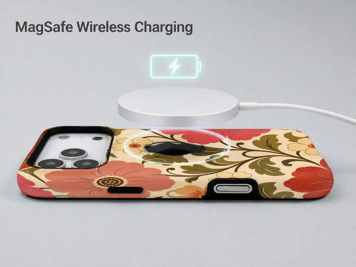 Coral Retro Folk Floral MagSafe Loop iPhone Case shown with a MagSafe-compatible wireless charger attached