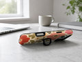 Coral Retro Folk Floral MagSafe Loop iPhone Case shown in a neutral white professional lifestyle setting