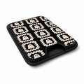 Cream Ghost Granny Square Pattern MagSafe Card Holder, angled view showing the thumb access opening