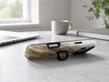 Cream Gold Geode Marble MagSafe Loop iPhone Case shown in a neutral white professional lifestyle setting