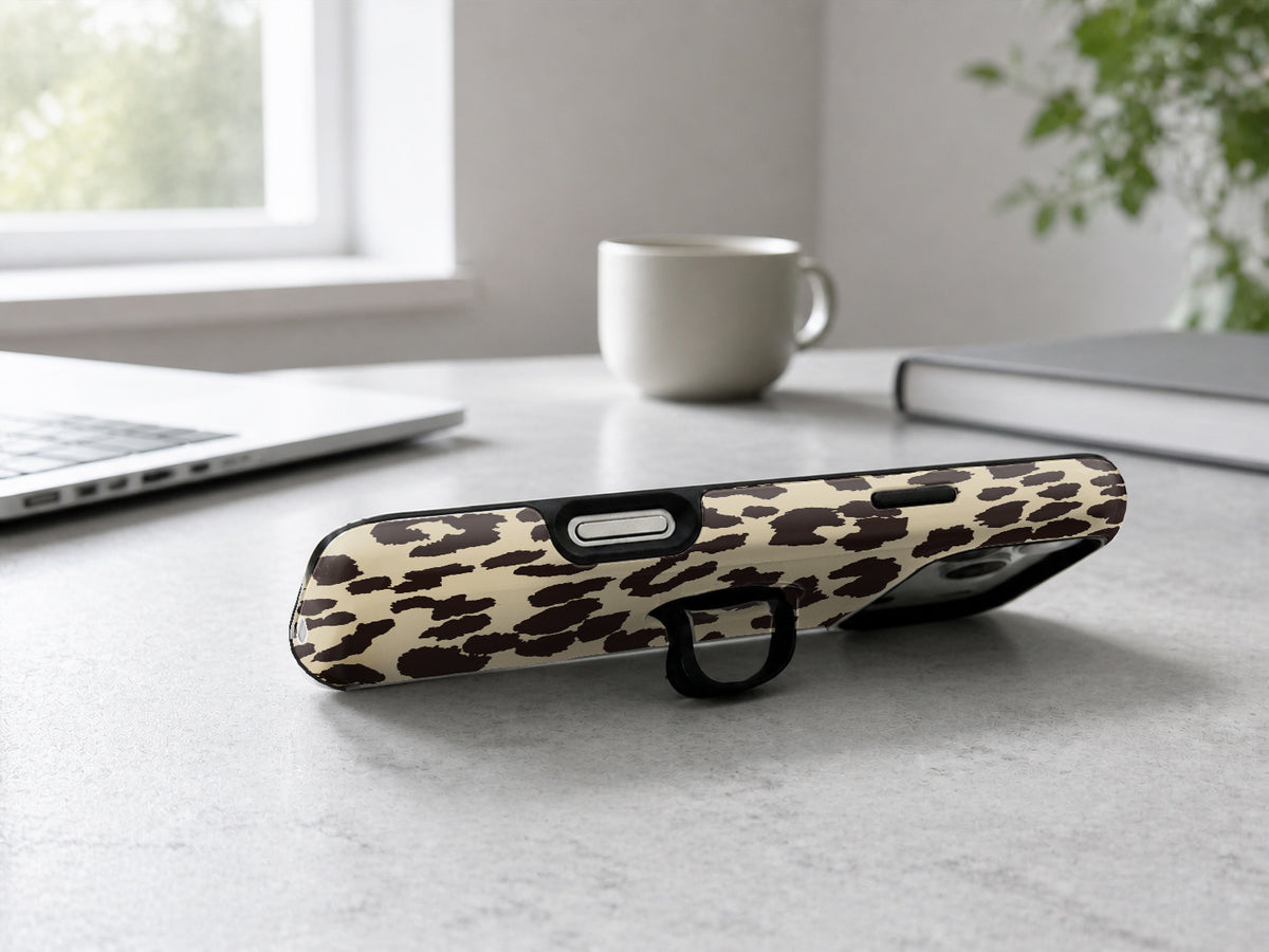 Cream Leopard Print MagSafe Loop iPhone Case shown in a neutral white professional lifestyle setting