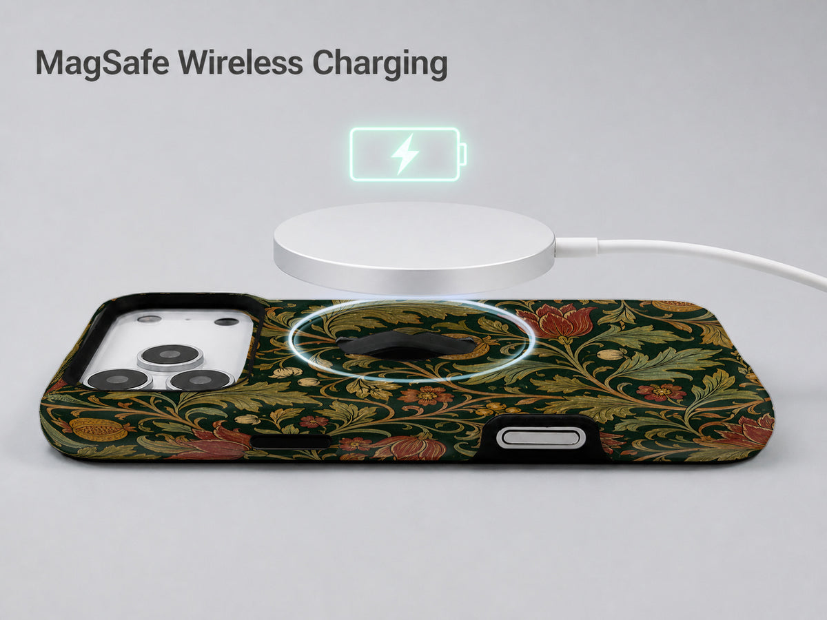 Dark Arts and Crafts Floral MagSafe Loop iPhone Case shown with a MagSafe-compatible wireless charger attached
