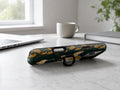 Dark Green Crane MagSafe Loop iPhone Case shown in a neutral white professional lifestyle setting