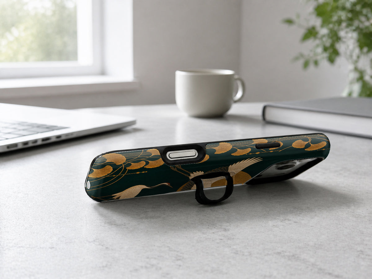 Dark Green Crane MagSafe Loop iPhone Case shown in a neutral white professional lifestyle setting