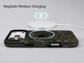 Dark Vintage Botanical MagSafe Loop iPhone Case shown with a MagSafe-compatible wireless charger attached
