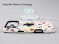 Delicate Mixed Wildflower MagSafe Loop iPhone Case shown with a MagSafe-compatible wireless charger attached