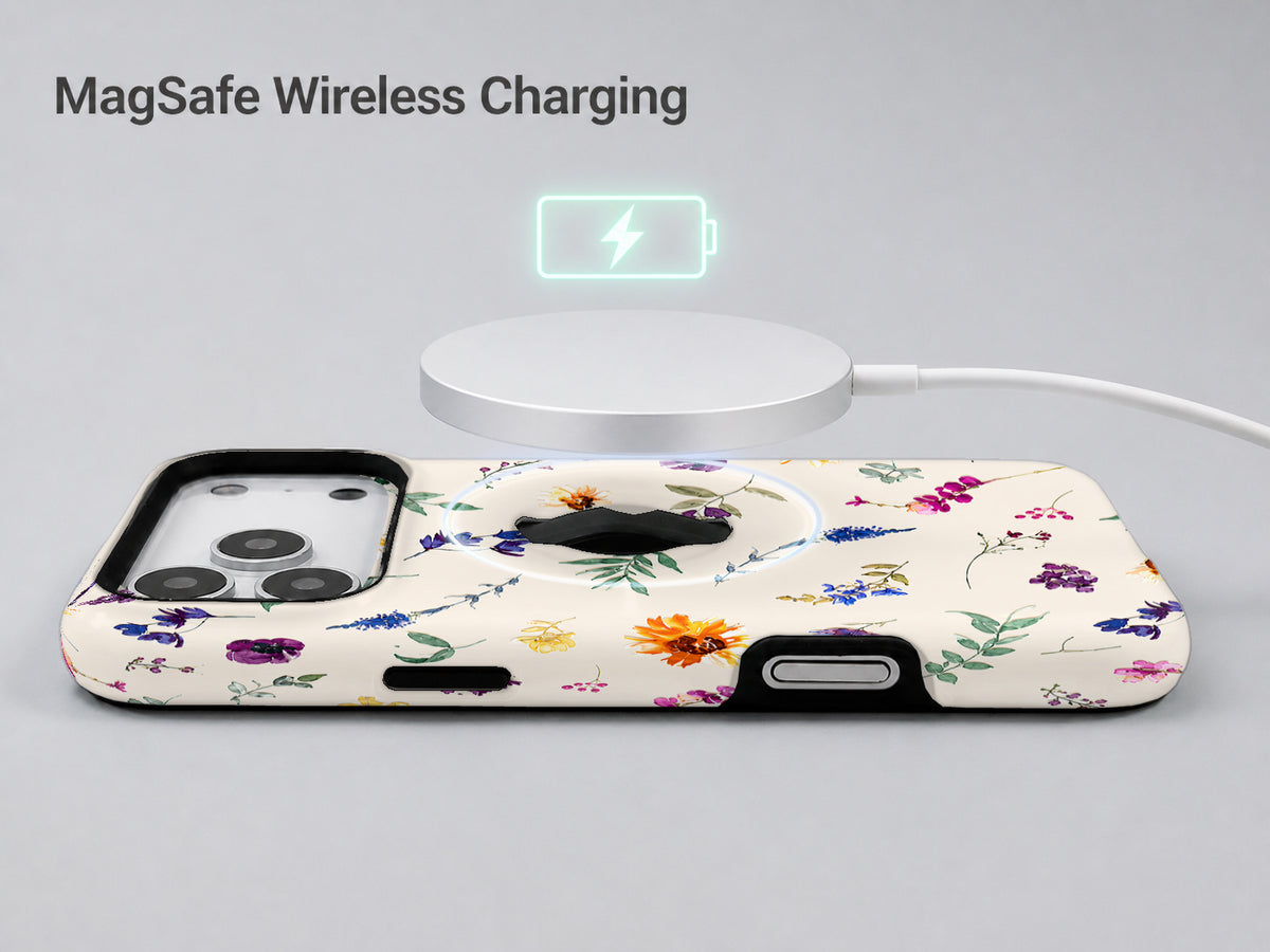 Delicate Mixed Wildflower MagSafe Loop iPhone Case shown with a MagSafe-compatible wireless charger attached